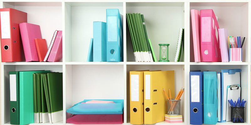 Office Supplies Organized by Color in a Shelf
